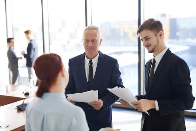 senior-businessman-talking-to-employees-2021-09-24-04-04-48-utc (1)